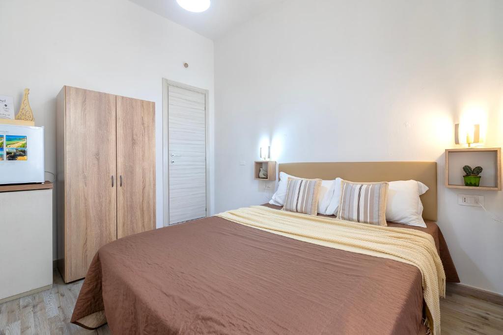 Postel nebo postele na pokoji v ubytování Alguer Guest House