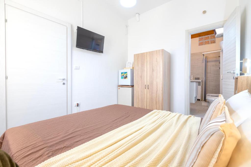 Postel nebo postele na pokoji v ubytování Alguer Guest House