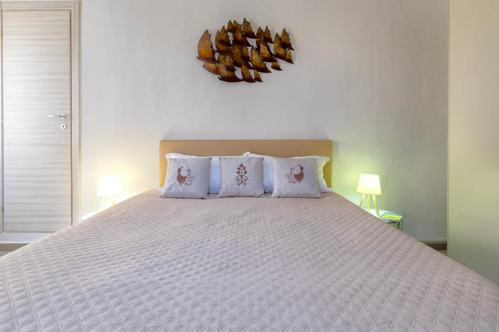 Postel nebo postele na pokoji v ubytování Alguer Guest House