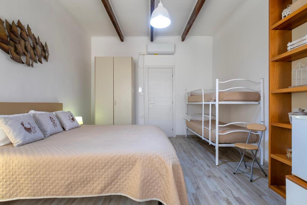 Postel nebo postele na pokoji v ubytování Alguer Guest House