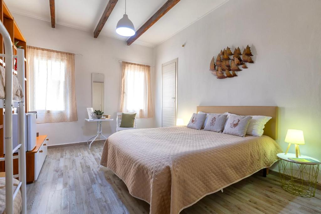Postel nebo postele na pokoji v ubytování Alguer Guest House