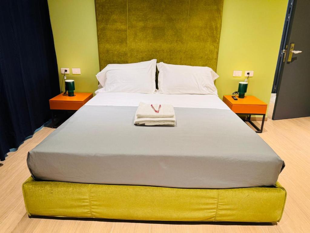 Ένα ή περισσότερα κρεβάτια σε δωμάτιο στο Hotel Vitruvio