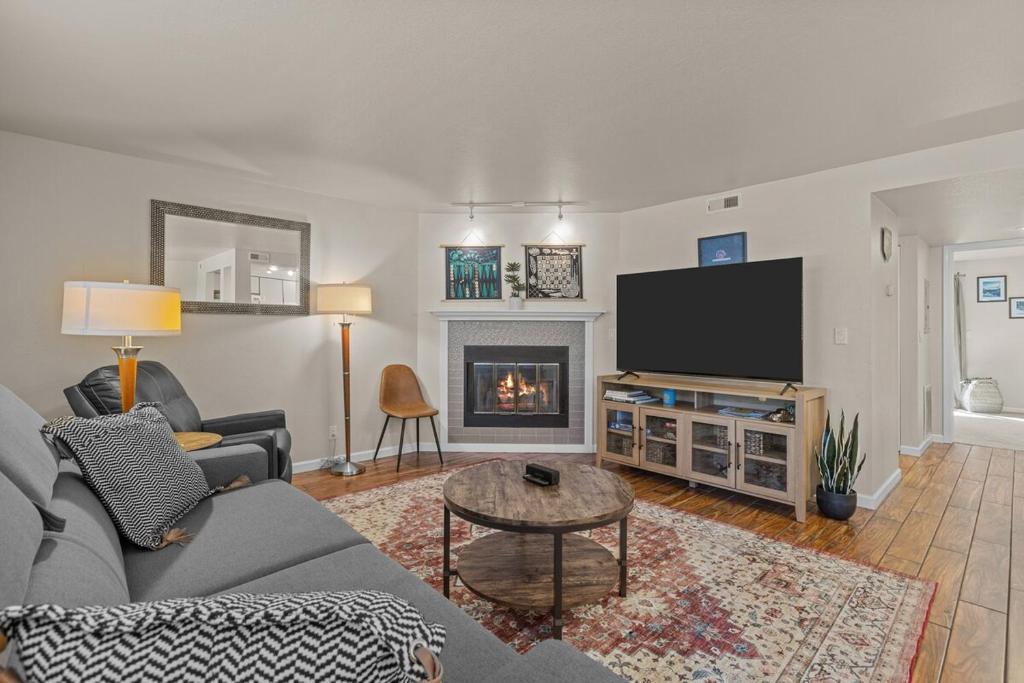 a living room with a couch and a tv at Idaho Treasure Hunt in Boise