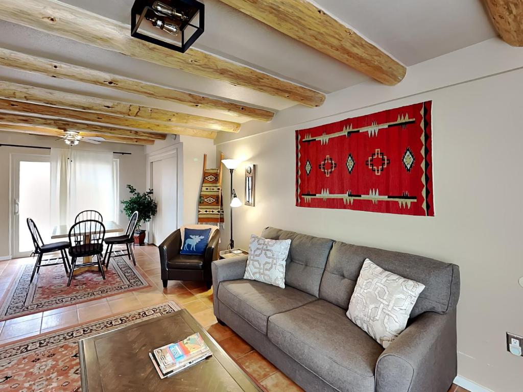a living room with a couch and a table at Casita De Alces in Santa Fe