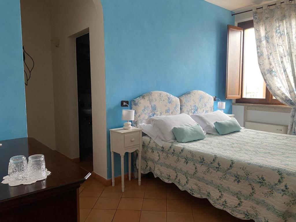 Postel nebo postele na pokoji v ubytování Arca Hotel