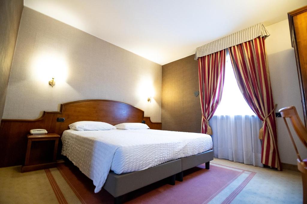 Postel nebo postele na pokoji v ubytování Hotel Rendez Vous