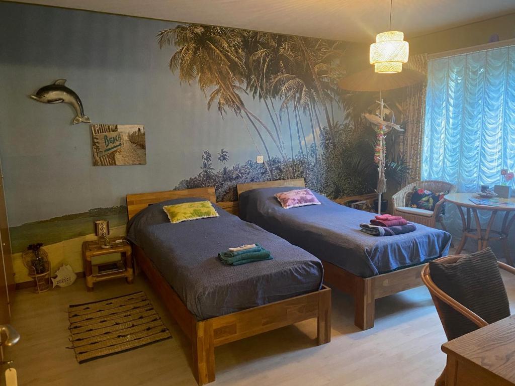Postel nebo postele na pokoji v ubytování Beachroom 19m2 with mountain view