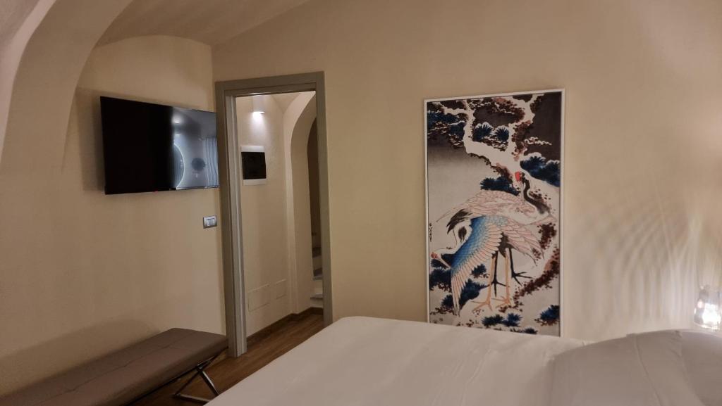 Postel nebo postele na pokoji v ubytování Albergo Trieste Boves - Ricetto Suite
