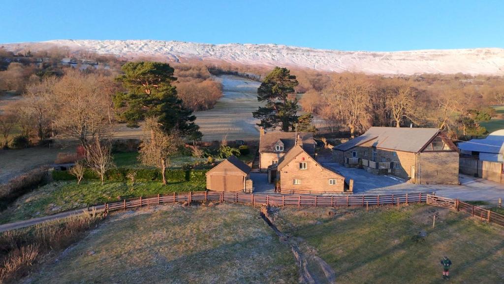 an aerial view of a farm with a house at White Haywood Farmhouse in Hereford