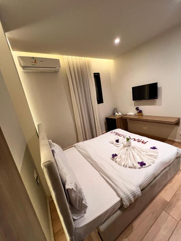 Postel nebo postele na pokoji v ubytování Imhotep Pyramids Hotel