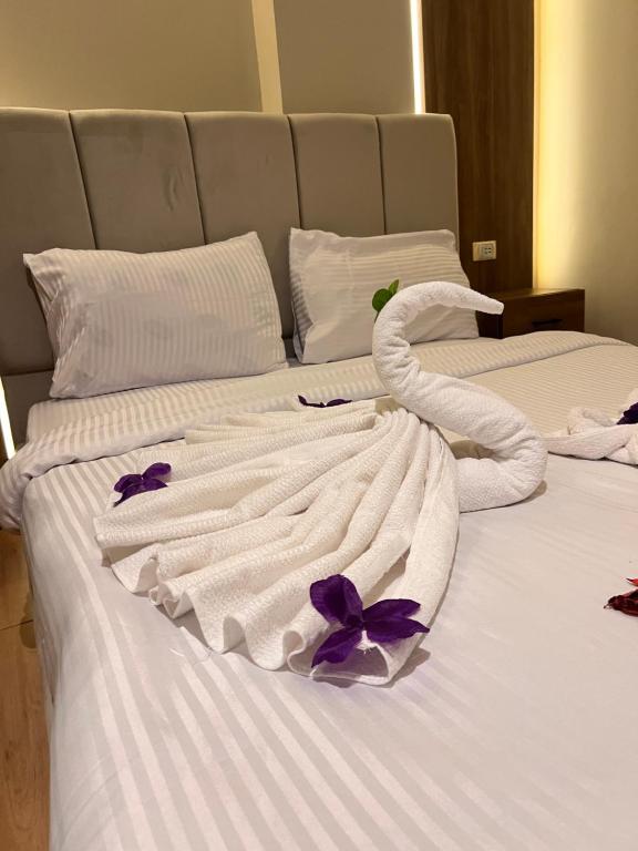 Postel nebo postele na pokoji v ubytování Imhotep Pyramids Hotel