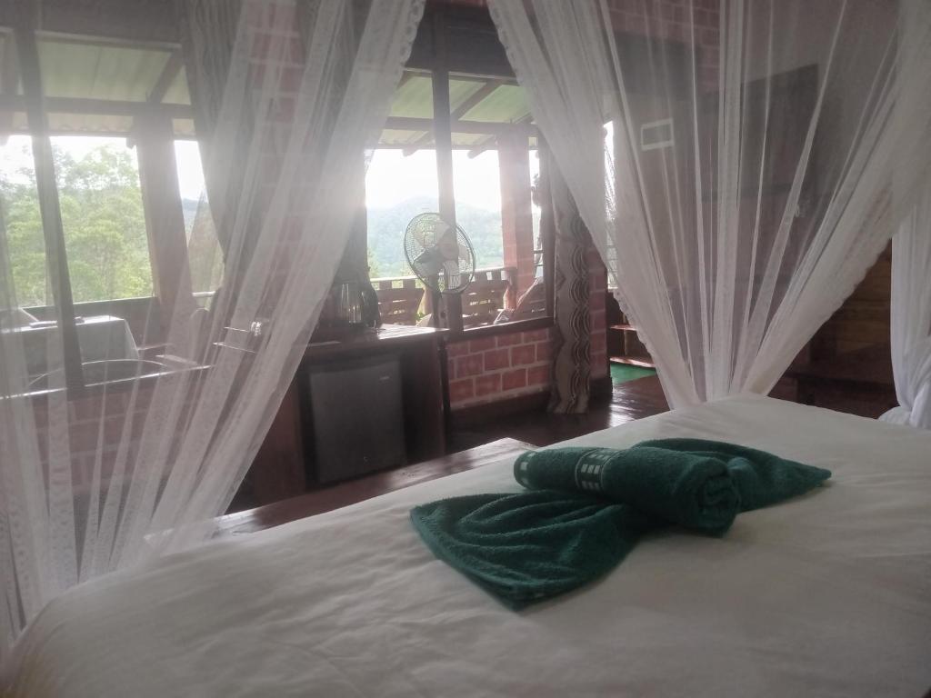 Postel nebo postele na pokoji v ubytování NETHSARA cottage