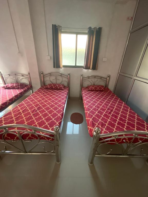 Voodi või voodid majutusasutuse Maa Janki Dormitory toas