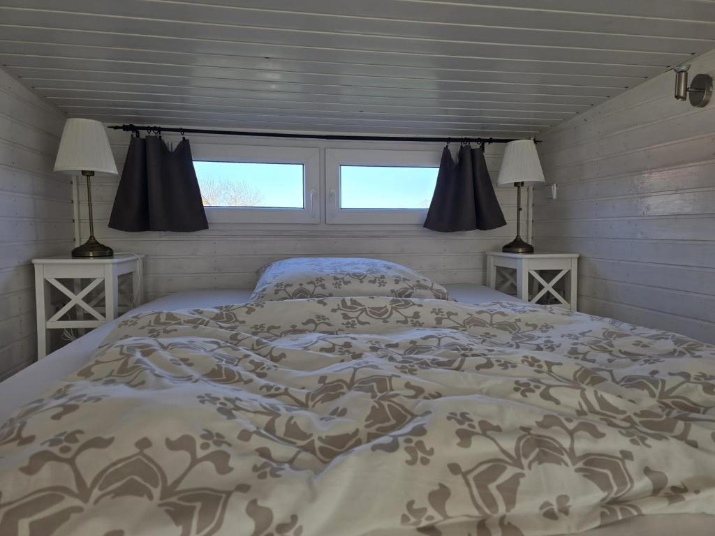 Postel nebo postele na pokoji v ubytování Tiny House