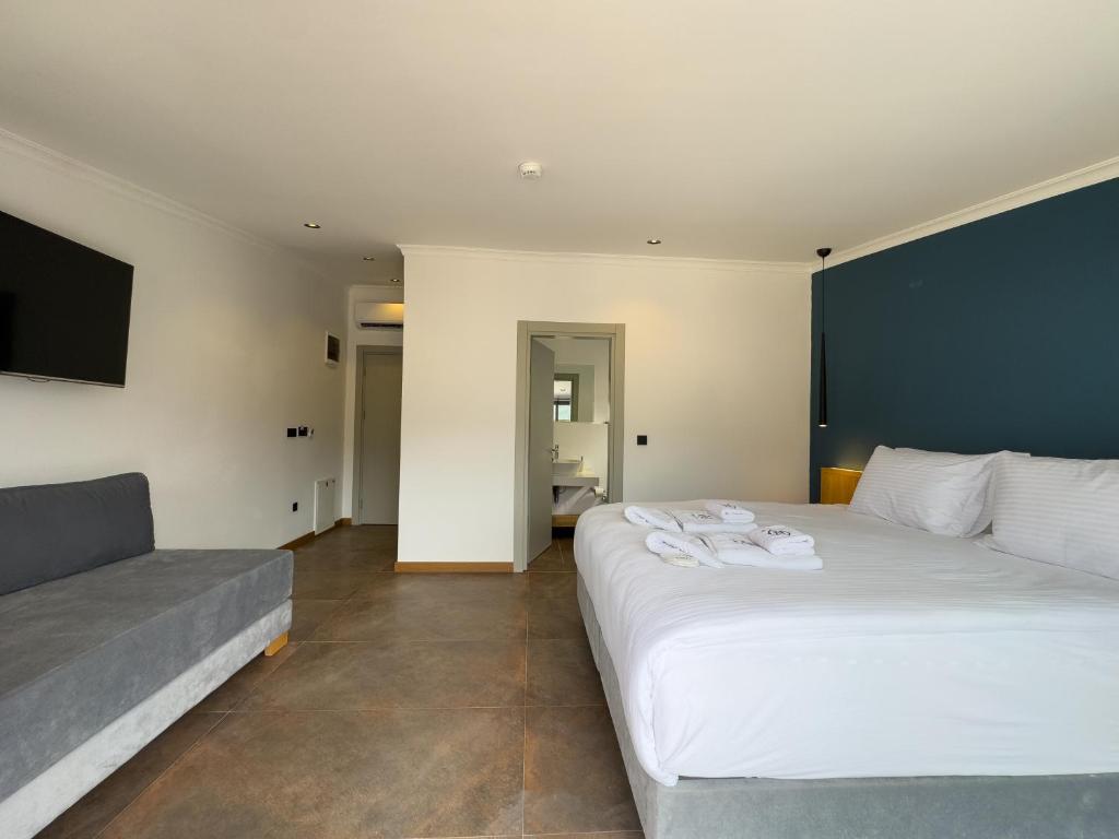Postel nebo postele na pokoji v ubytování Nakas Hotel