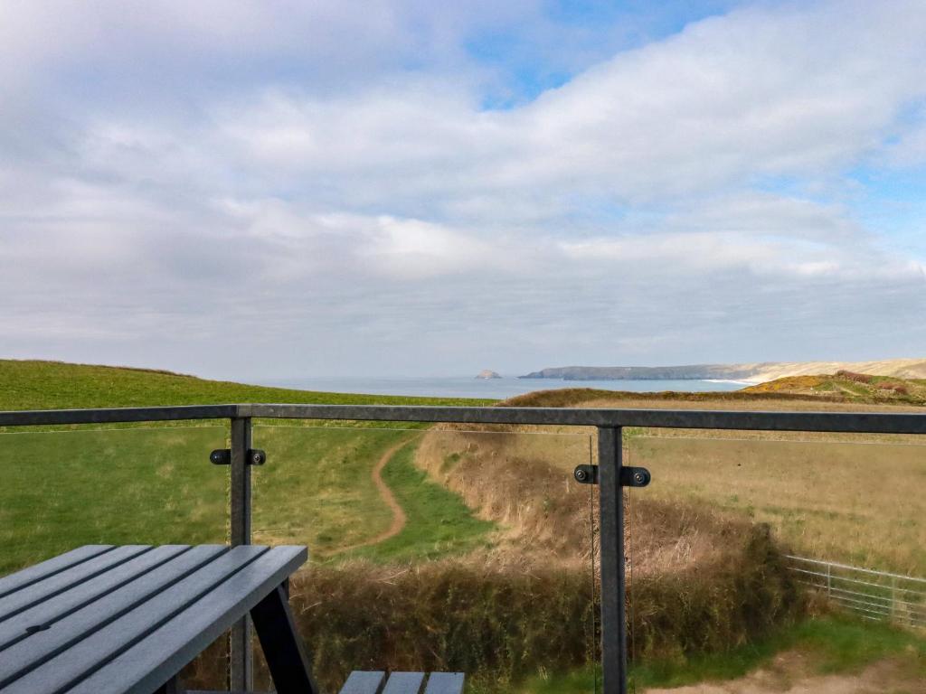 a view of the ocean from the balcony of a house at Jacana in Perranporth