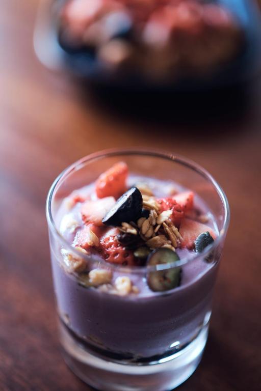 a glass filled with food on a wooden table at Murphy's Pub and Bed & Breakfast in Dingle