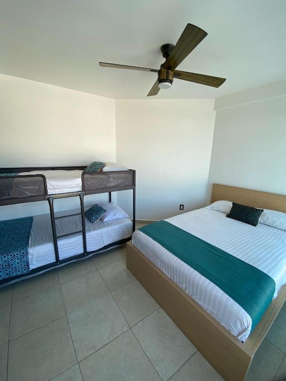 Postel nebo postele na pokoji v ubytování FRENTE PLAYA vista al mar, PISCINA DE USO EXCLUSIVO