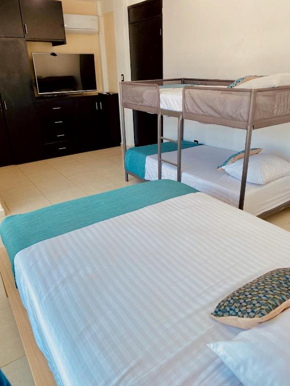 Postel nebo postele na pokoji v ubytování FRENTE PLAYA vista al mar, PISCINA DE USO EXCLUSIVO