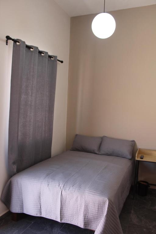 Postel nebo postele na pokoji v ubytování Lofts Sayula Independencia