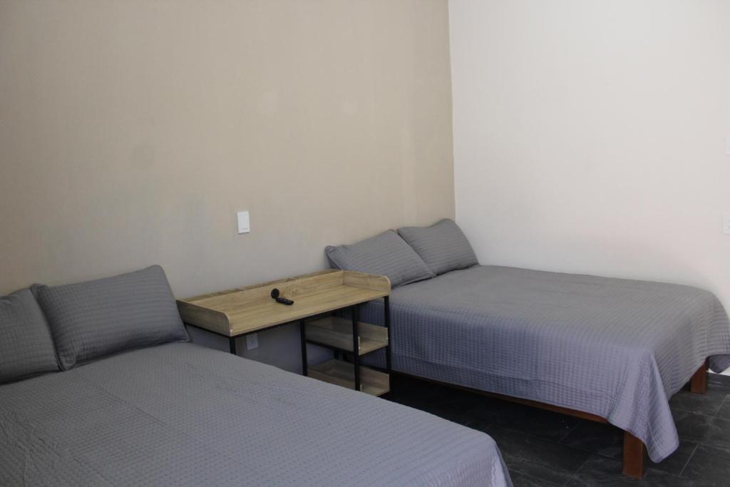 Postel nebo postele na pokoji v ubytování Lofts Sayula Independencia