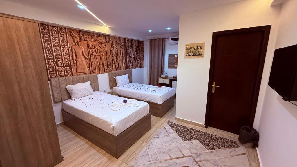 Voodi või voodid majutusasutuse Locanda pyramids view toas