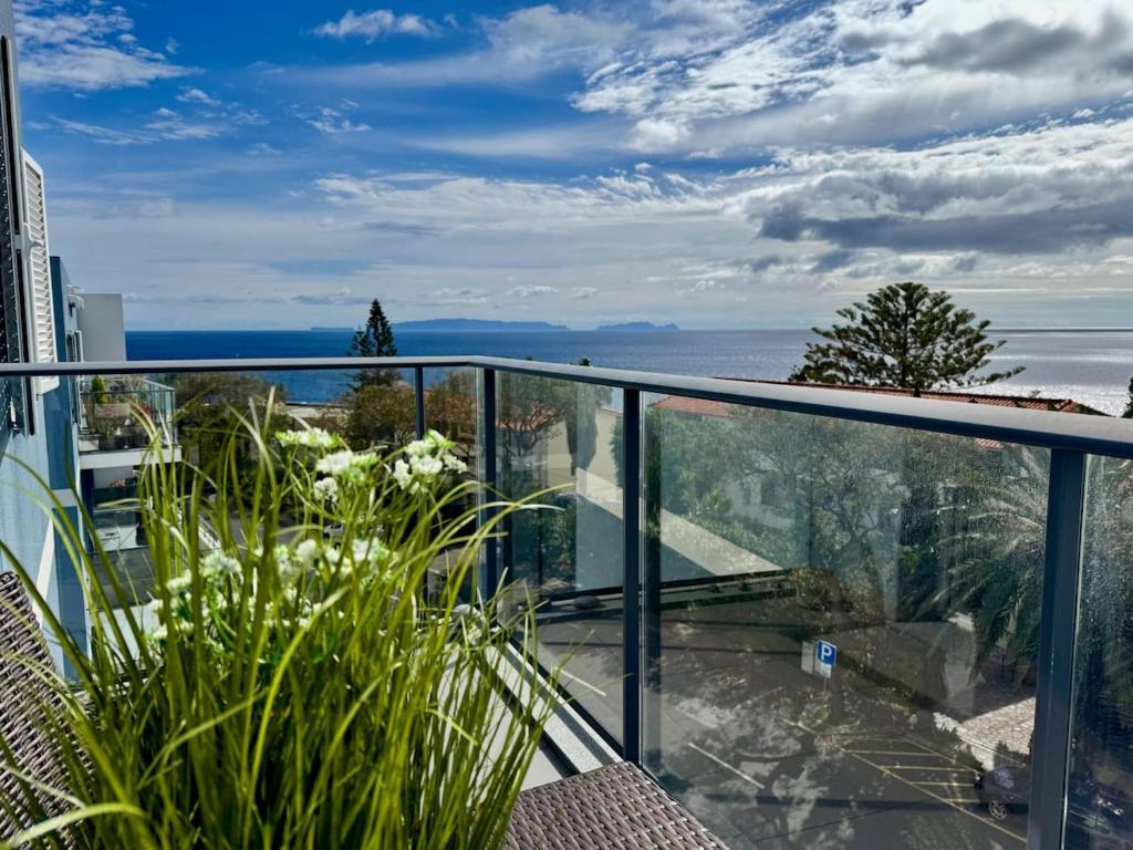 a balcony with a view of the ocean at Welcome to Paradise Island in Caniço