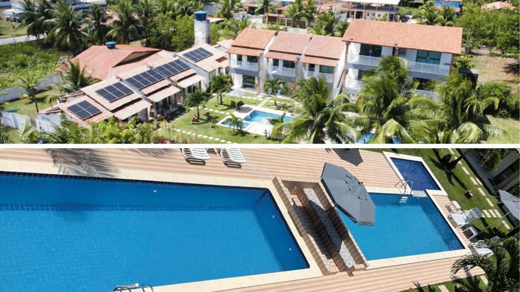 an aerial view of a resort with a swimming pool at Pousada Villa Minduba in Japaratinga