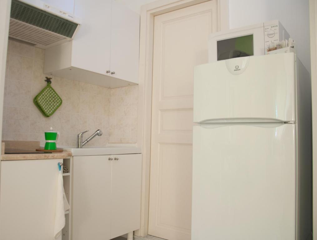 Kuchyň nebo kuchyňský kout v ubytování B&B Le Comari Salentine