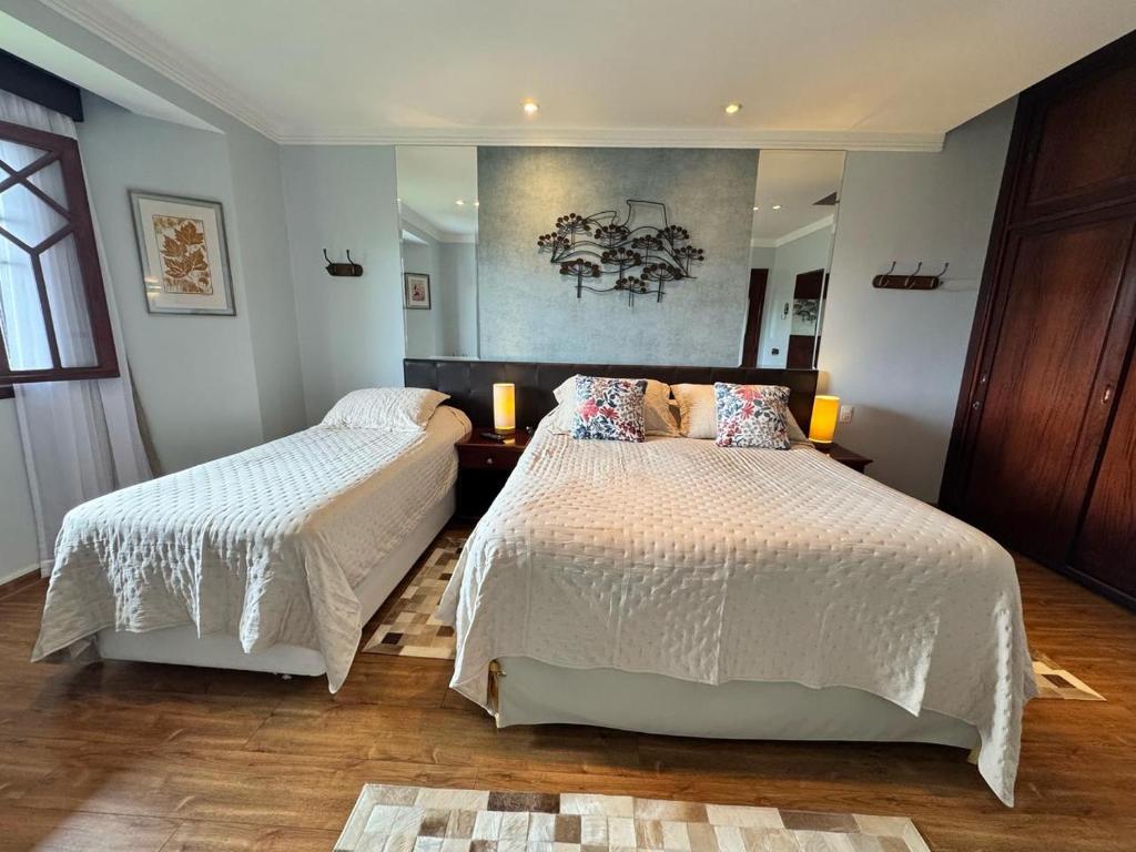 En eller flere senge i et værelse på Home Green Home - Apto 115