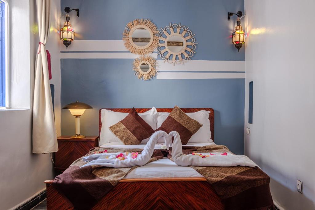 Postel nebo postele na pokoji v ubytování Riad Bobby Marrakech