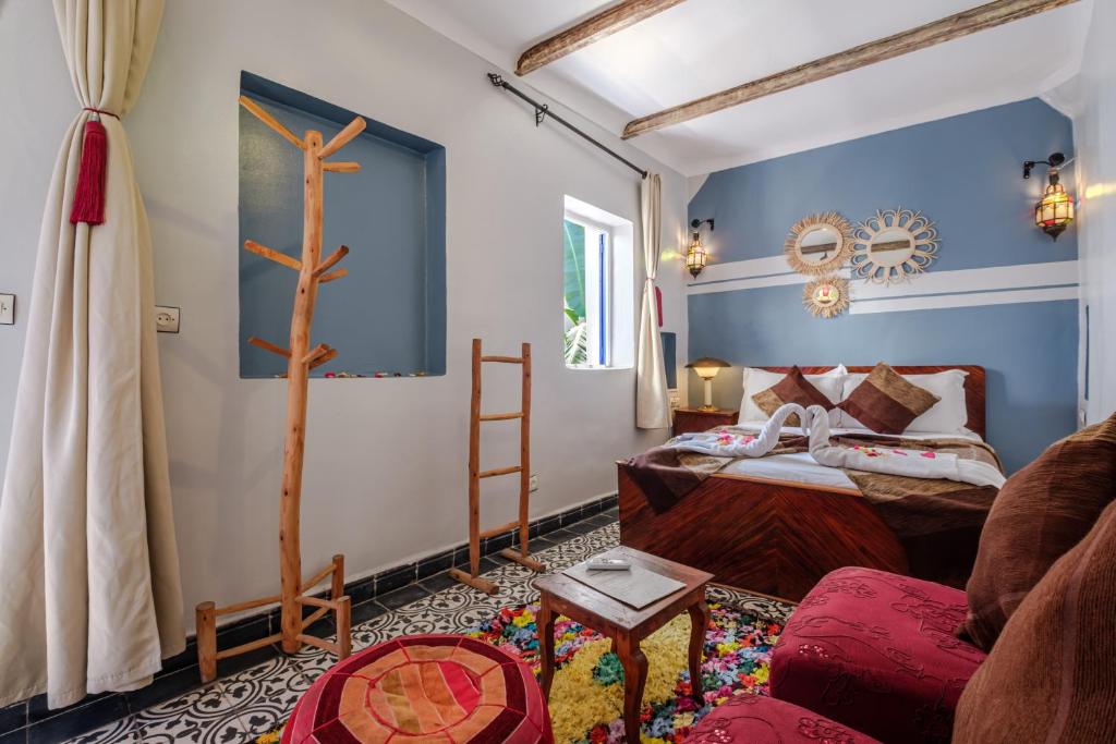 Postel nebo postele na pokoji v ubytování Riad Bobby Marrakech