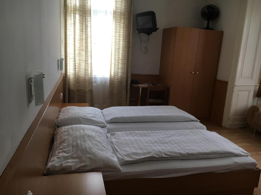 Posteľ alebo postele v izbe v ubytovaní Pension Ani