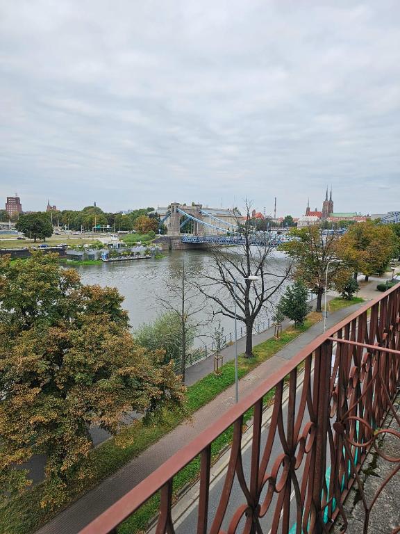a view of a river from a bridge at 11Wygodny pokój z pięknym widokiem na Odrę in Wrocław