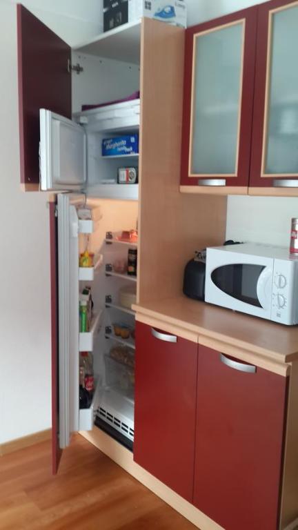 Kuchyň nebo kuchyňský kout v ubytování Apartment Albaré Residence