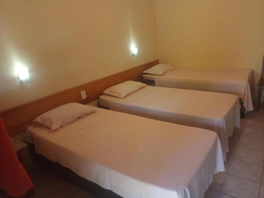 Postel nebo postele na pokoji v ubytování Hotel Patipe Canavieiras