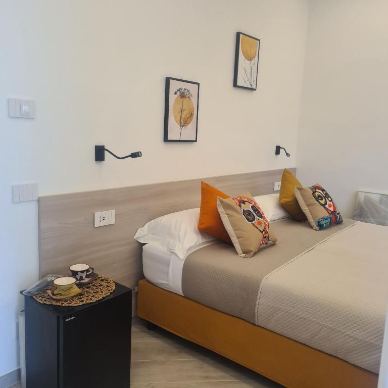 a bedroom with a bed with pillows on it at Tenuta Rispoli Pogerola in Amalfi