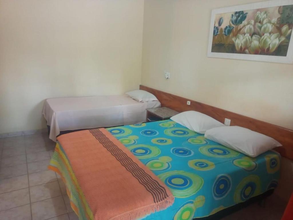 Postel nebo postele na pokoji v ubytování Hotel Patipe Canavieiras