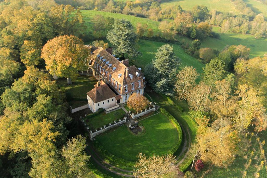 an aerial view of a large house in a field at Monastere de Brucourt in Brucourt
