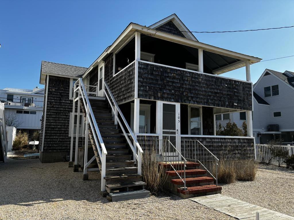 a brick house with a staircase in front of it at Bay Views! Wifi Bay Side Duplex In Ship Bottom in Ship Bottom