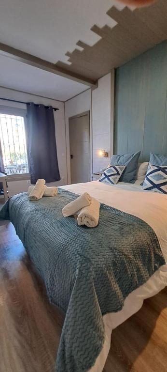 Postel nebo postele na pokoji v ubytování Villa Palma