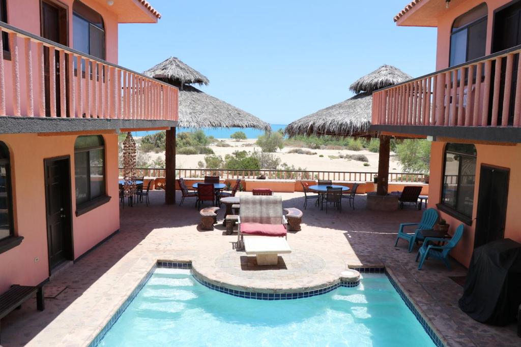 a resort with a swimming pool and a patio at Ocotillo del Mar in San Felipe