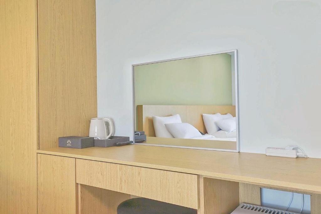 Postel nebo postele na pokoji v ubytování Berith Hotel