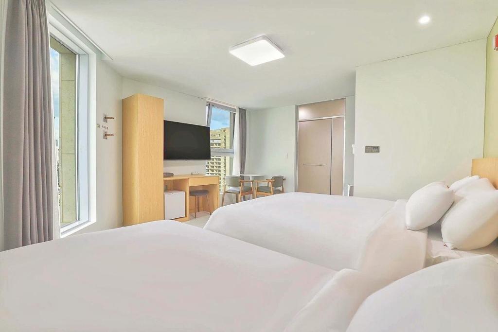 Postel nebo postele na pokoji v ubytování Berith Hotel