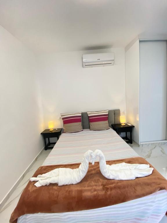 Postel nebo postele na pokoji v ubytování Sol playa piscina