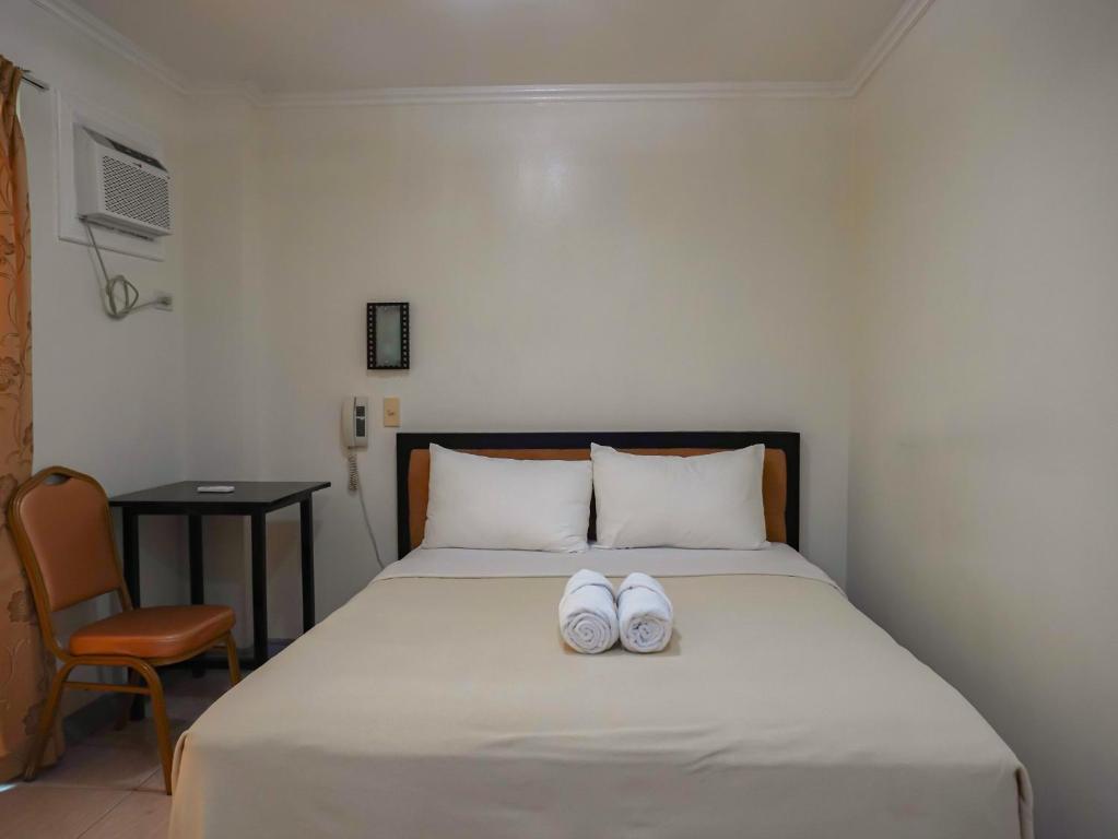 Postel nebo postele na pokoji v ubytování Boracay Paradise Hotel