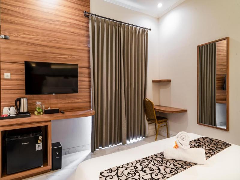 Kuchyň nebo kuchyňský kout v ubytování Ayers Hotel&Resto