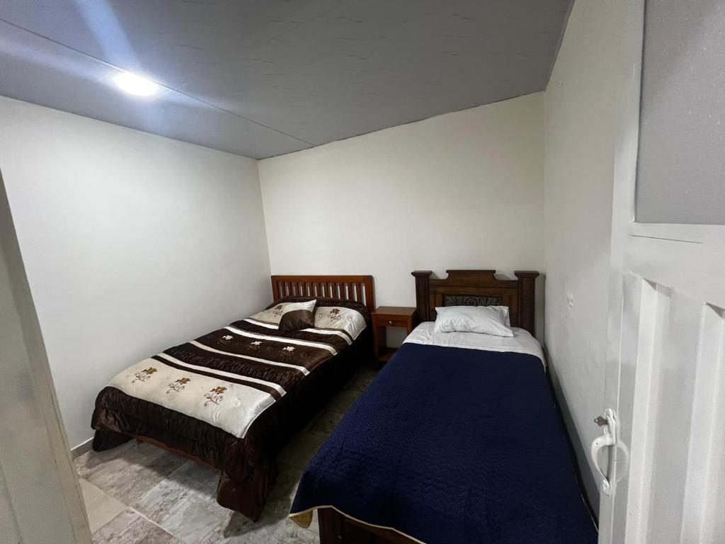 Postel nebo postele na pokoji v ubytování Hotel Finca los Cristales