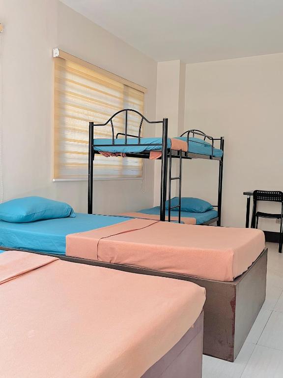 Postel nebo postele na pokoji v ubytování RNJ Hotel