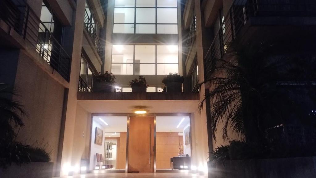 a hallway of a building at night with lights at Rental Tigre in Tigre